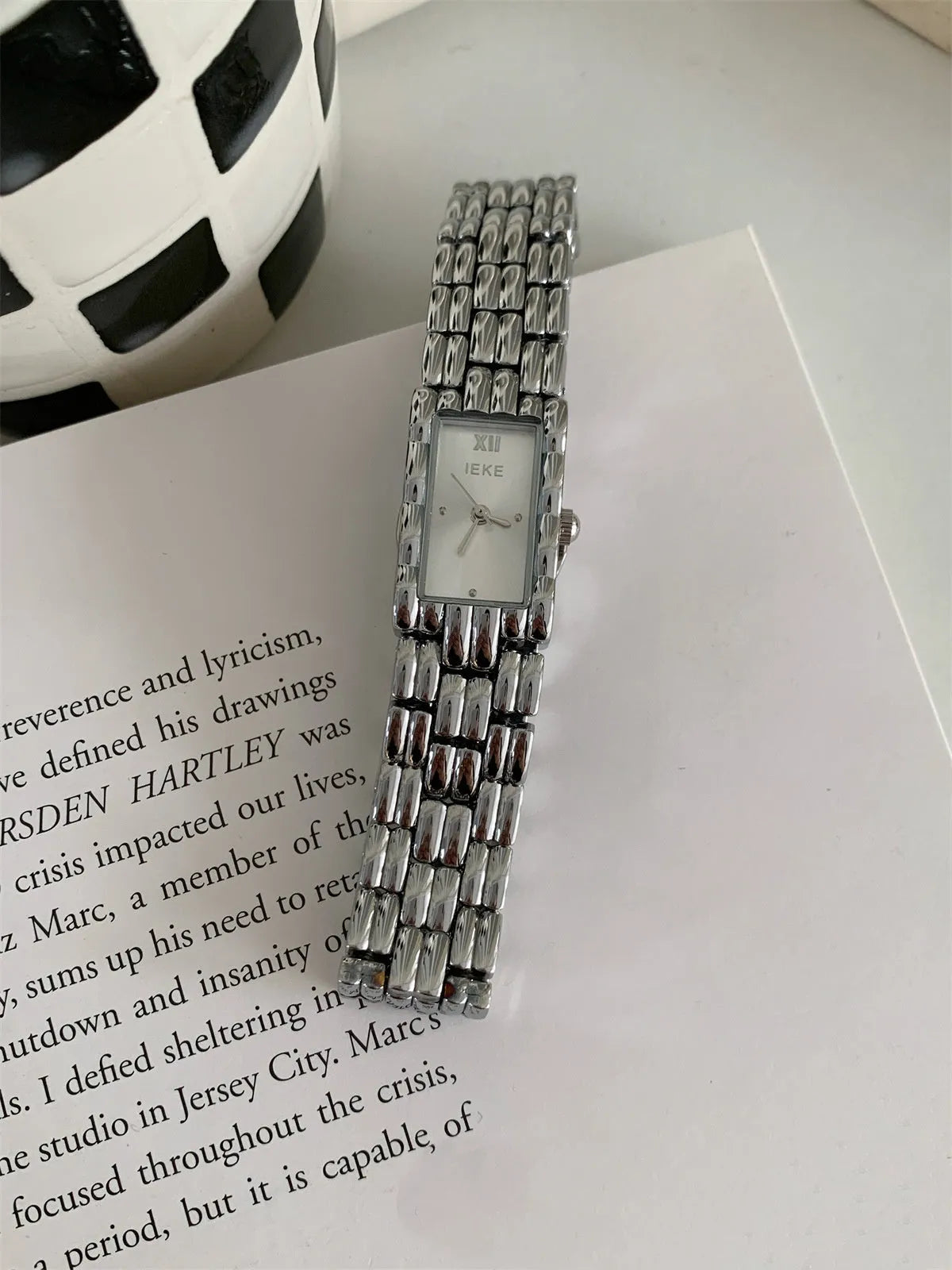 Women's mid-century bracelet watch with a 15mm dial, stainless steel case, and butterfly clasp in silver and gold colour options.