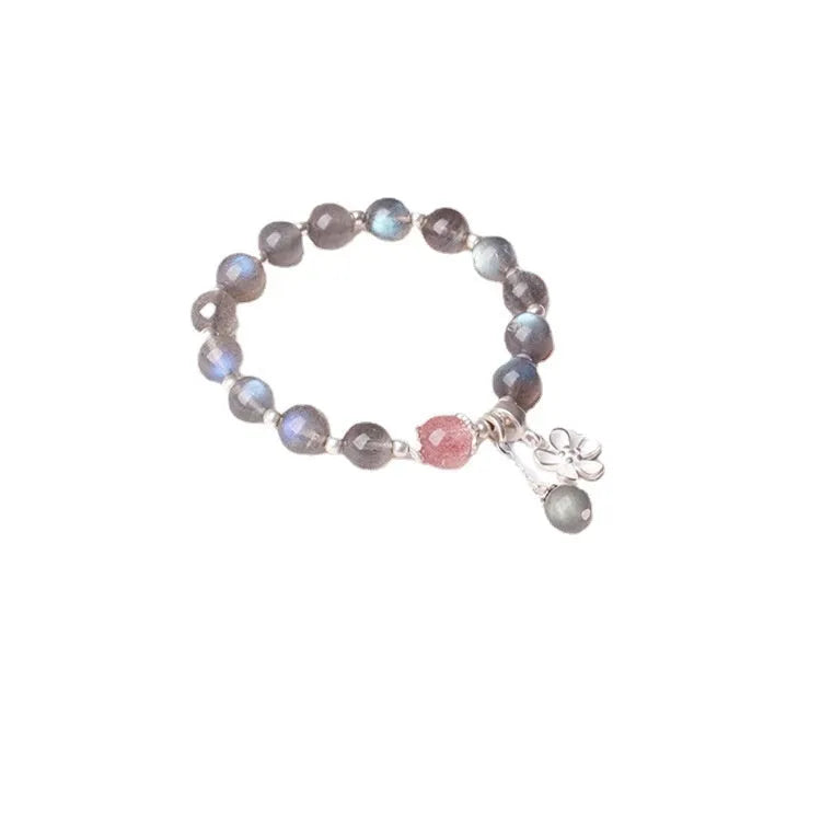 Women's silver bracelet with grey moonstone and zodiac charm.