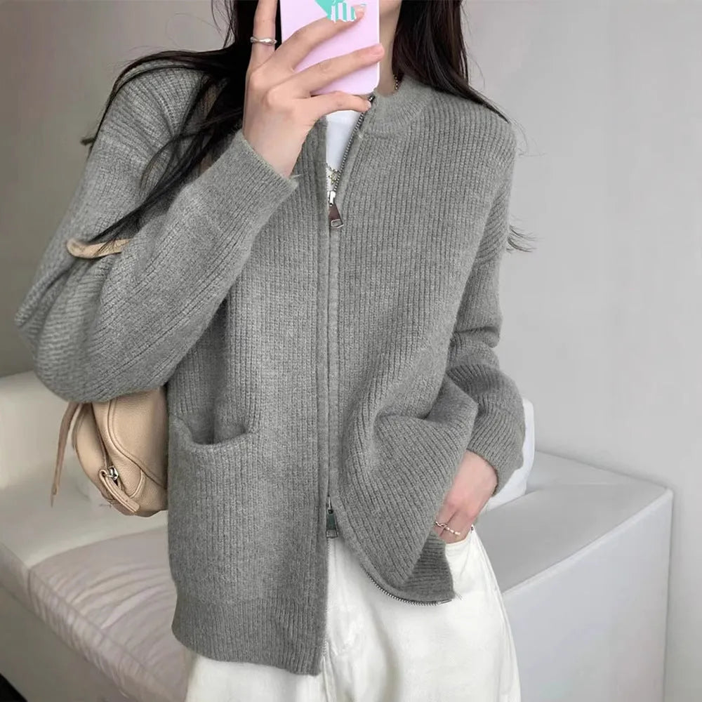 Beige soft viscose long sleeve sweater coat cardigan on a hanger.