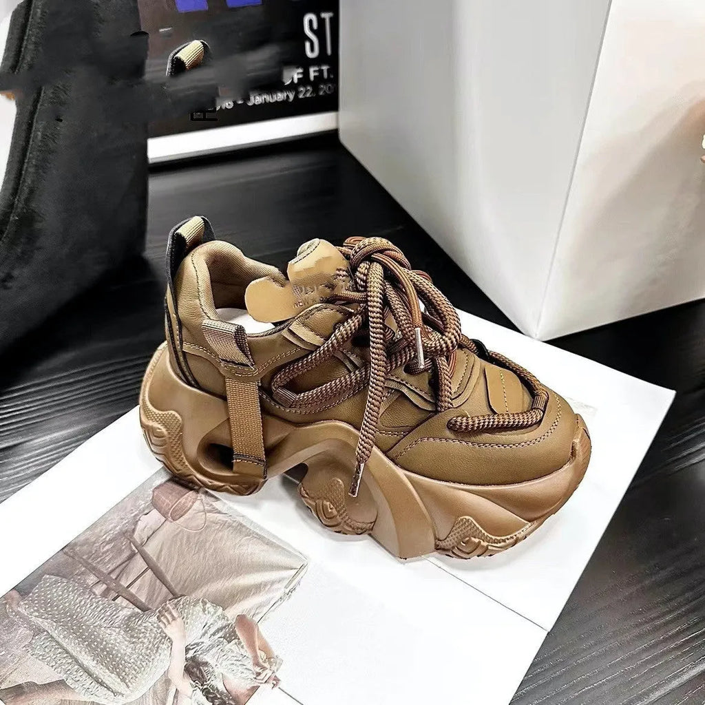 Women's creamy white casual sneakers with a wedge heel and cross-strap detail.