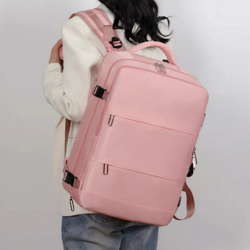 Large purple travel backpack with multiple compartments and an air pillow strap system, shown on a neutral background.