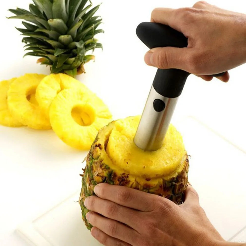 Stainless steel pineapple peeler with ergonomic handle and sawtooth blade on a countertop