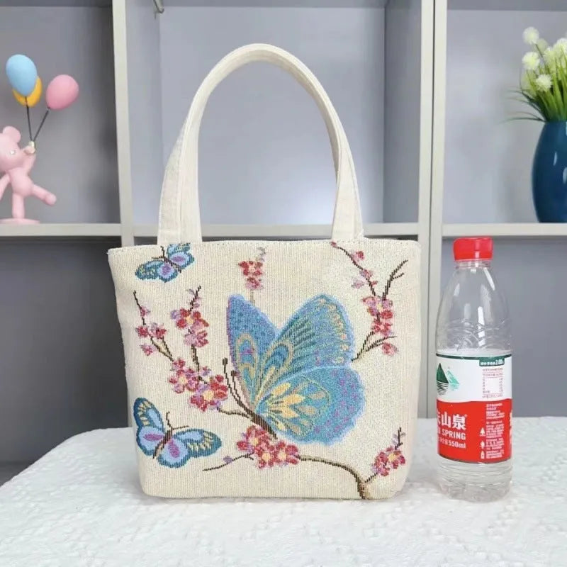Double-sided gold wire embroidered handheld canvas tote bag in a choice of seven patterns and three sizes.