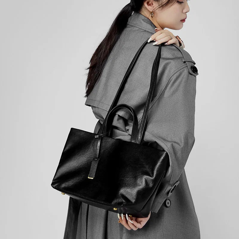 Genuine leather women's underarm shoulder bag in brown, 32x13x22cm, with sewing line detail