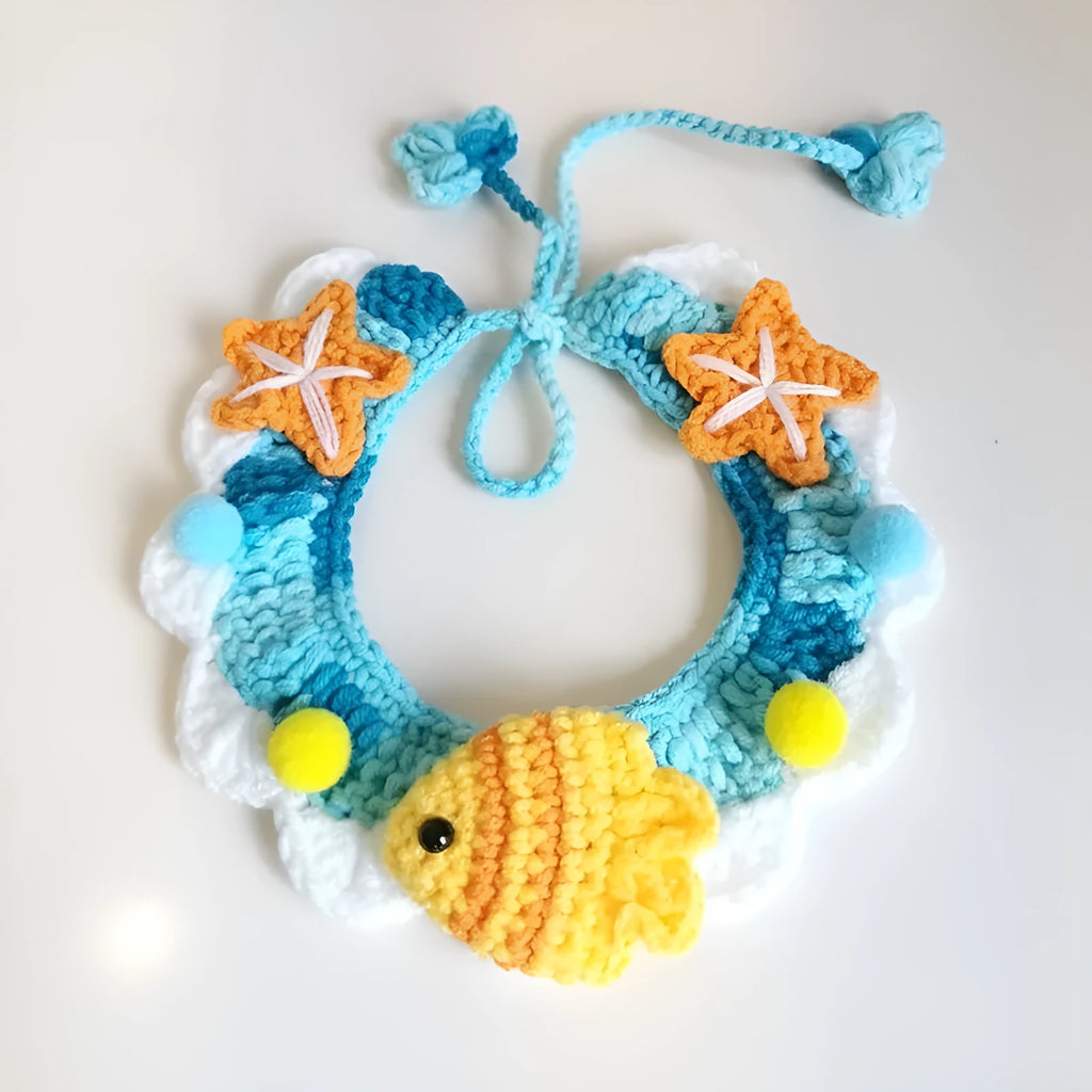 Hand-woven wool cat collar with cartoon Underwater World pattern in blue, size example on a light background
