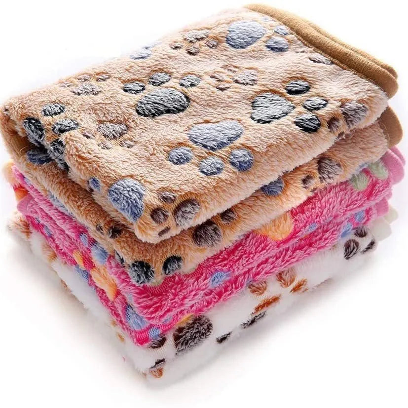 Coral fleece dog blanket with paw print design in multiple size options
