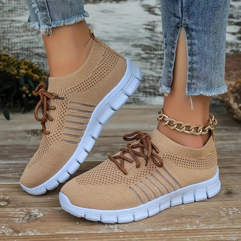 Ladies casual flat shoes in beige with breathable mesh upper, round toe, and front lace closure.