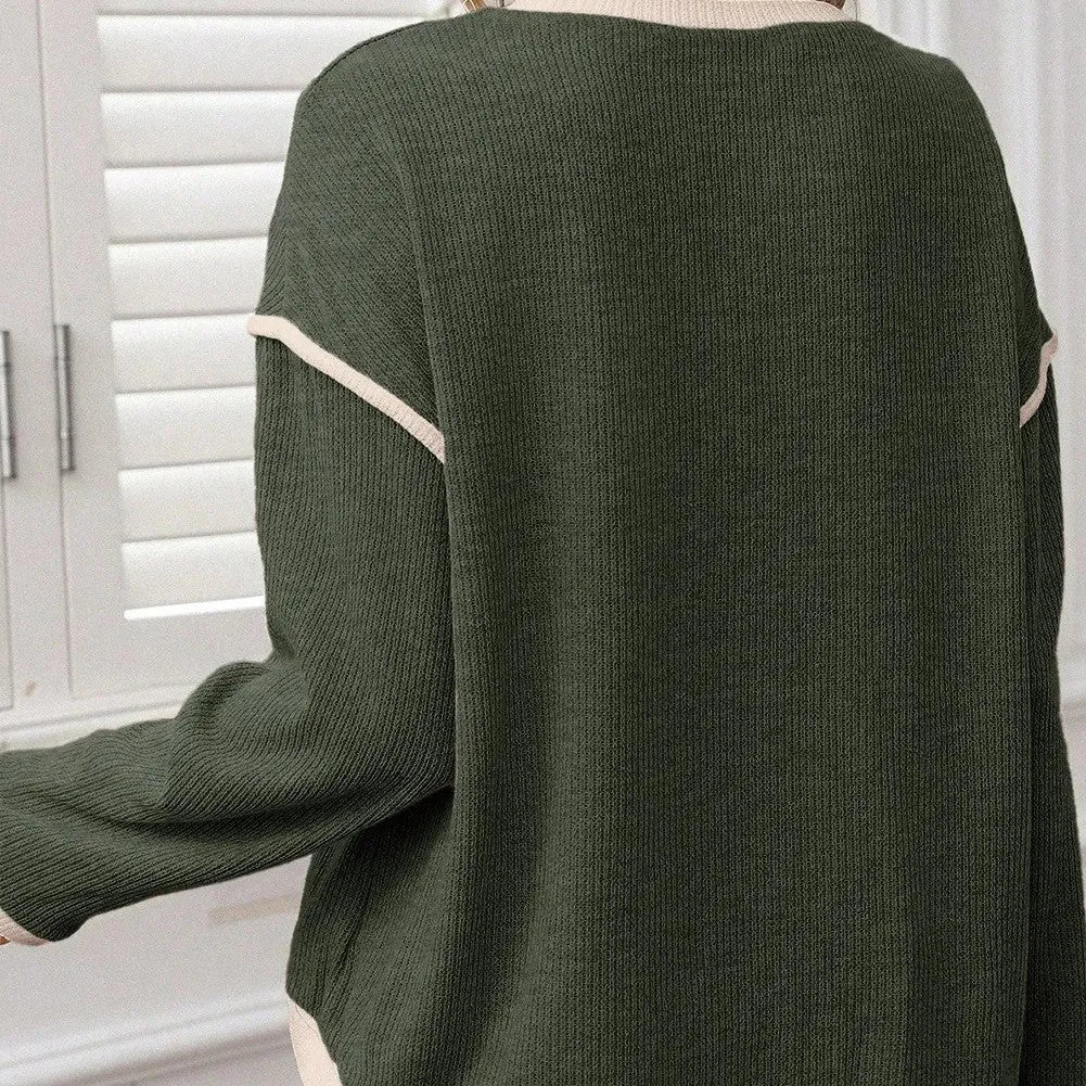 Drop shoulder loose knit top with four leaf clover contrast trim on the front, shown in beige.