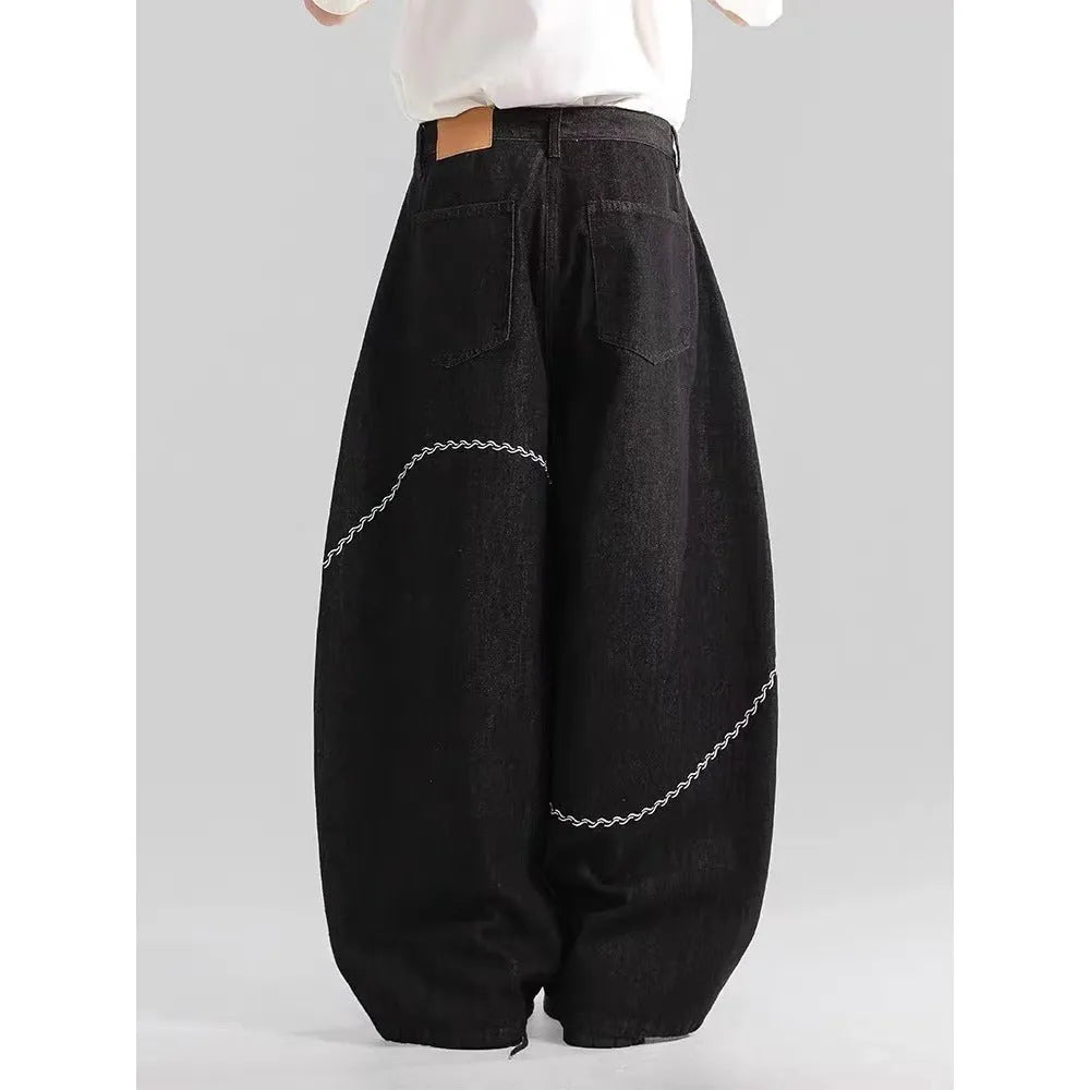 Black straight-leg jeans trousers with mid waist and zip placket closure on teenage model