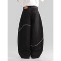 Black straight-leg jeans trousers with mid waist and zip placket closure on teenage model