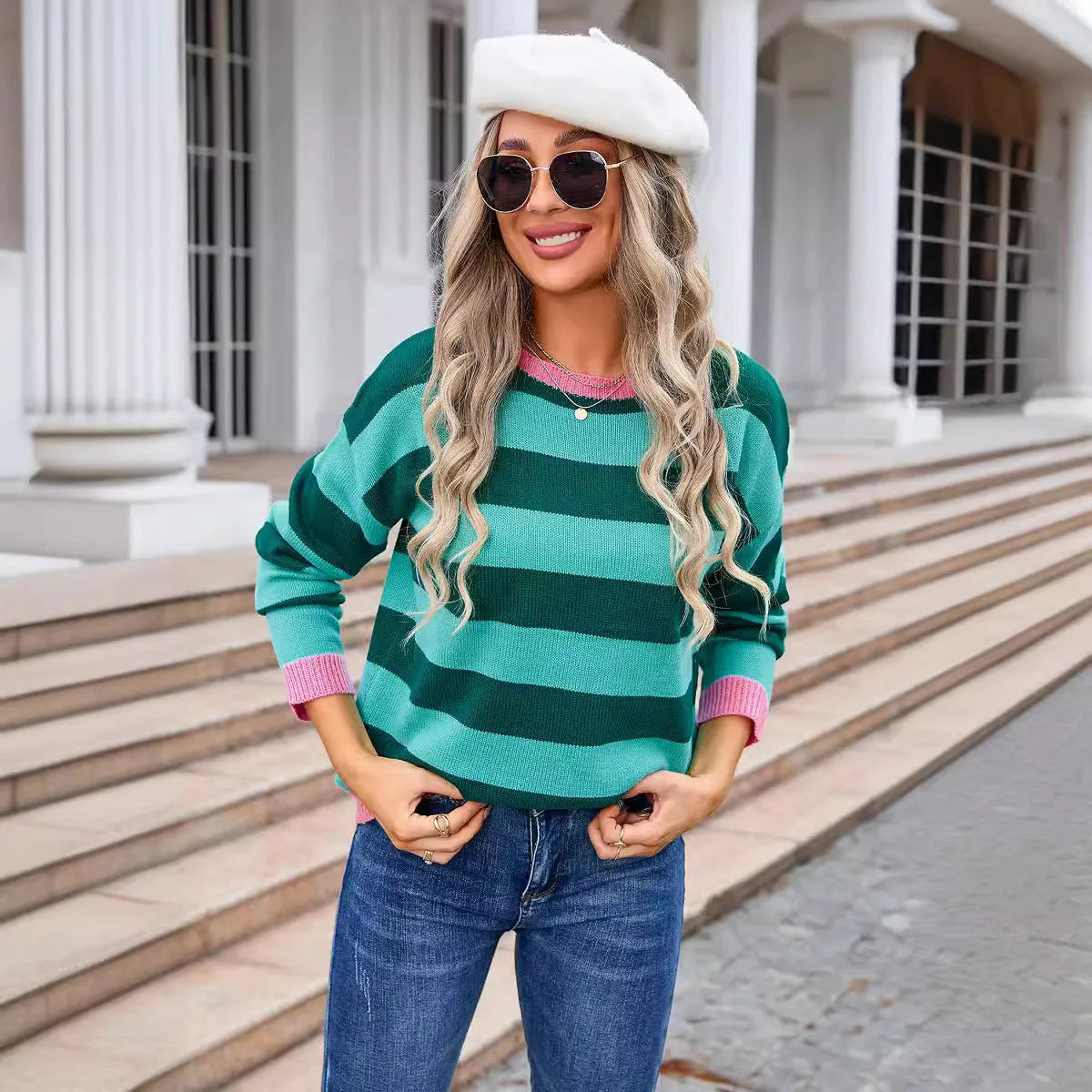 Women's loose fit long sleeve acrylic sweater in blue with a plaid pattern, featuring a round neck.