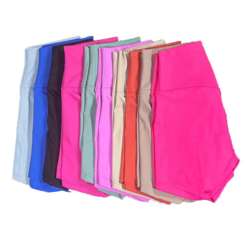 High-waisted women's yoga shorts in nylon fabric on a neutral background.