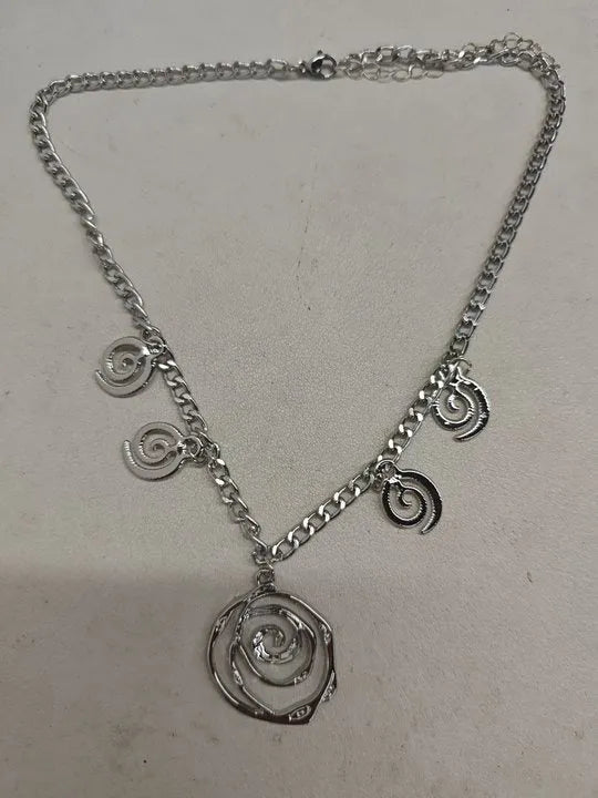 Women's spiral donut jewellery set with necklace, bracelet and earrings in gold or silver geometric design