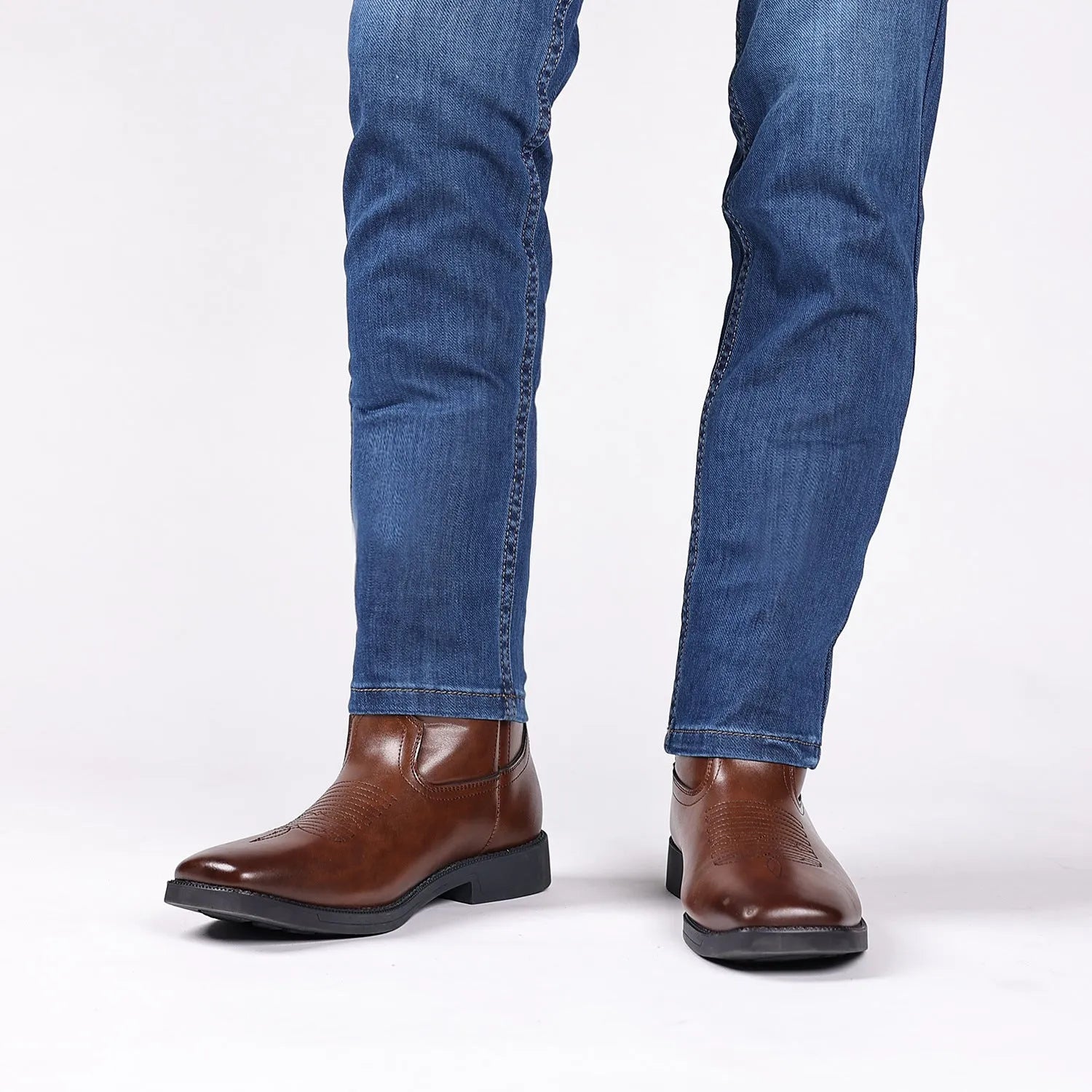 Men's brown retro cowboy boots with a square toe and horseshoe heel on a white background.