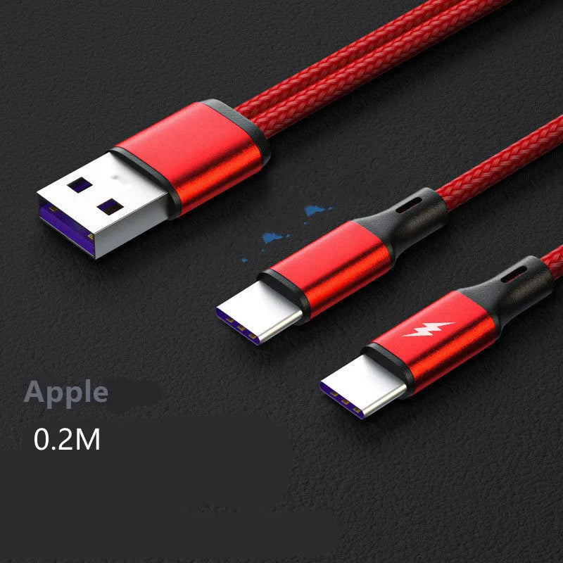 Black braided two-in-one USB charging cable with two Android connectors on a table.