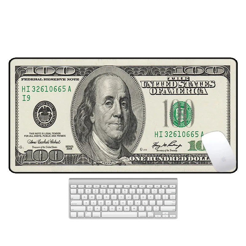 Large patterned desk mat for mouse and keyboard on a wooden desk.