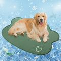 Ice silk dog cooling mat with dog head print, shown in light grey on a wooden floor.
