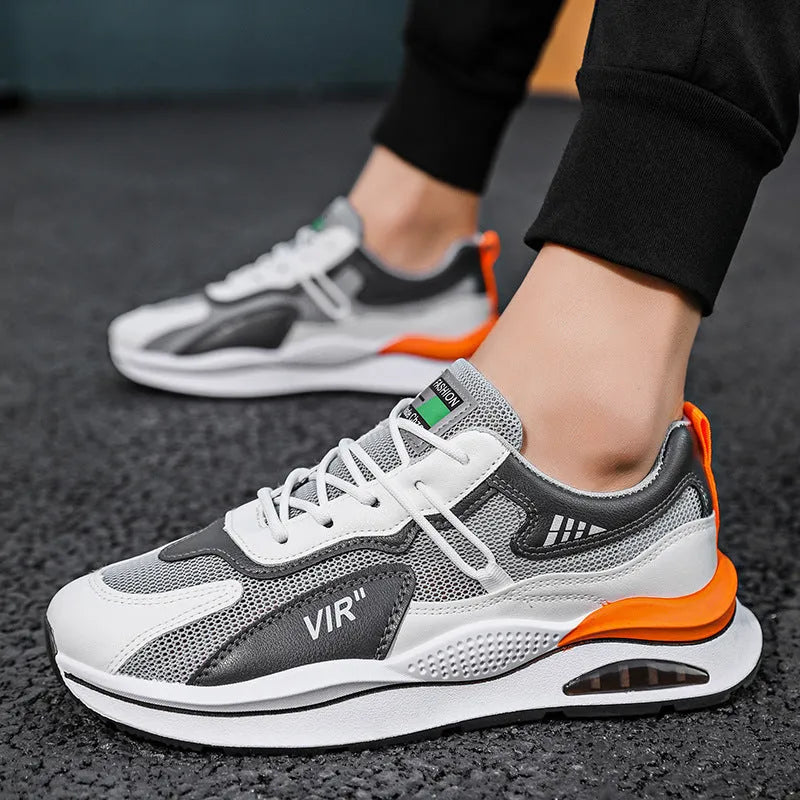 Men's grey mesh running shoes with round toe and middle top design on light background