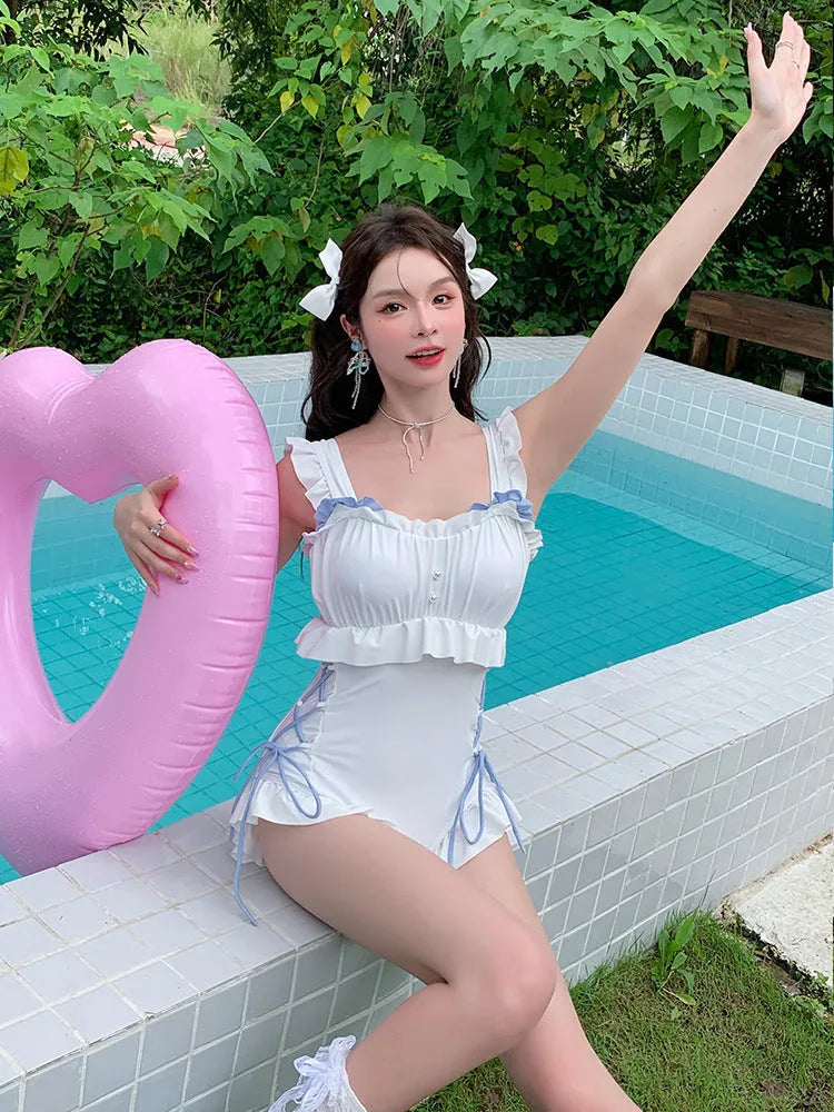 Milky White backless one-piece swimsuit for women on a mannequin