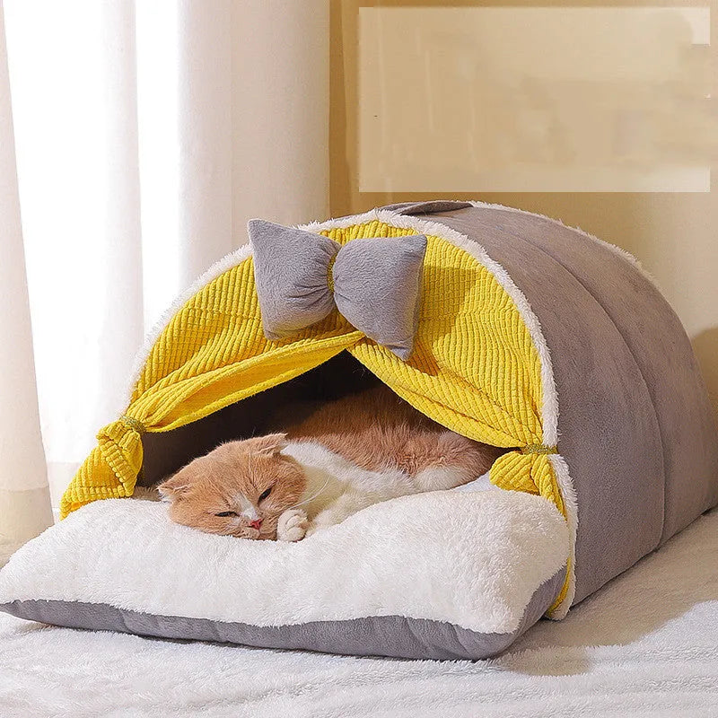 Semi-enclosed cat nest in creamy yellow cloth with grey mat, suitable for all-season indoor use