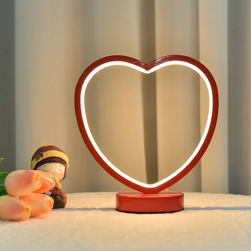Creative red wedding lantern USB table lamp with warm light and red heart ring design on a tabletop