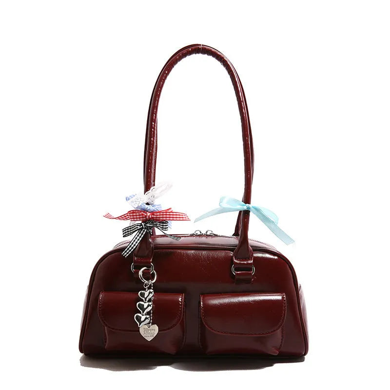 Retro brown PU leather pillow-shaped women's shoulder bag with double straps and a flap closure.