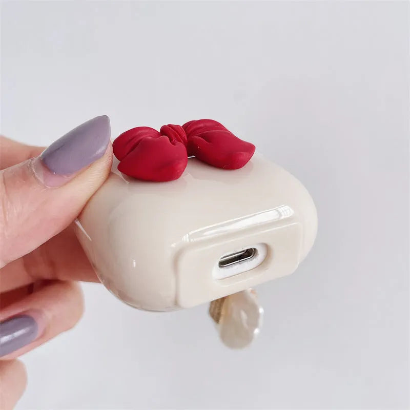 Beige red bow shell pendant TPU case for Apple AirPods wireless earphones with clamshell design