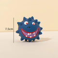 Set of four colourful squeaky dog balls with cute animal faces on a white background.