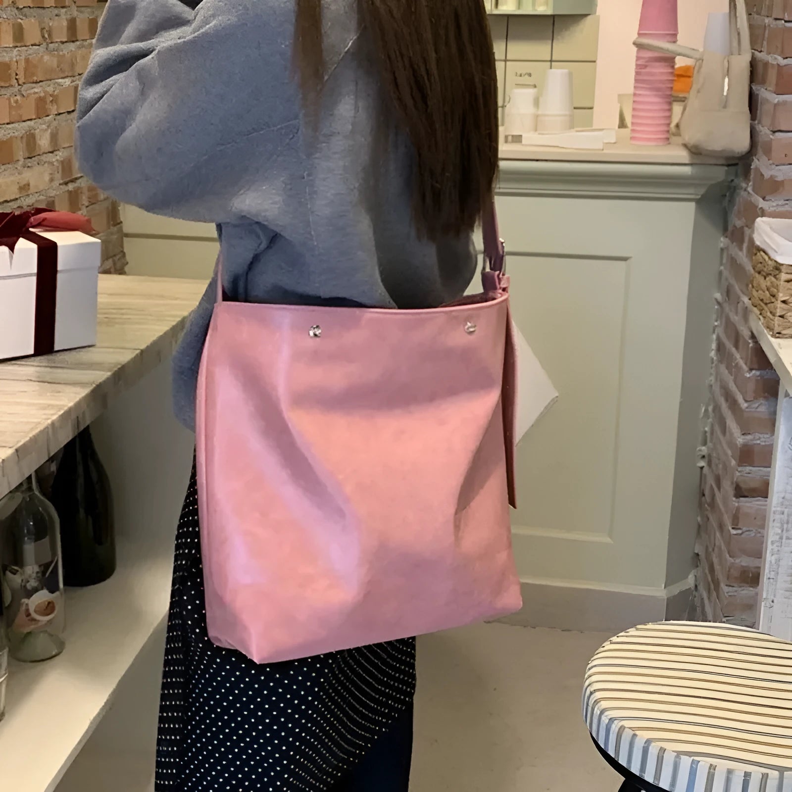Pink corduroy one-shoulder bag with a single strap, shown with dimensions.