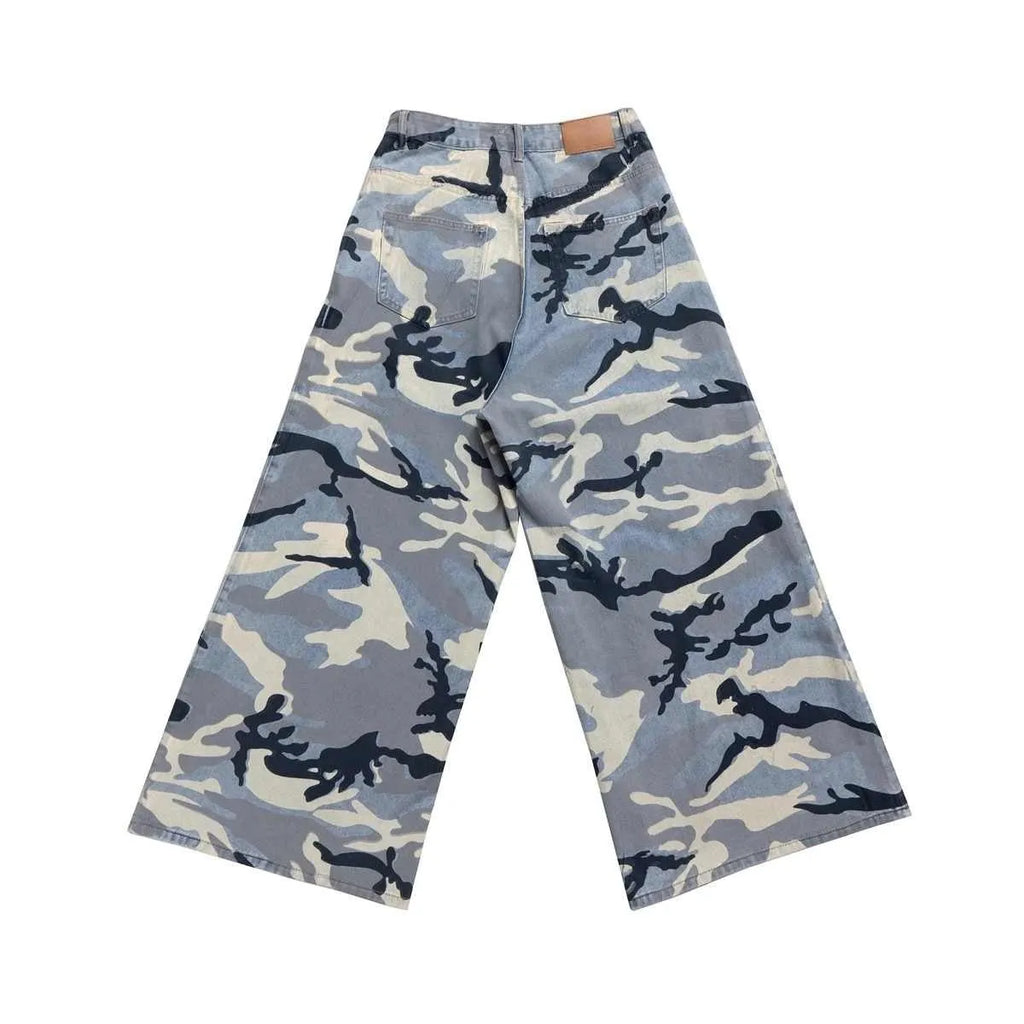 Man and woman wearing loose-fit snow camouflage blue jeans made from stretch cotton denim.