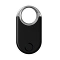 Black and white GPS pet and child tracker device showing compact size and USB charging port