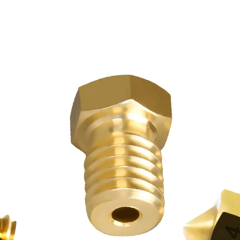 Close-up of a brass E3D-style 3D printer nozzle with M6 thread, showing its precise machining.