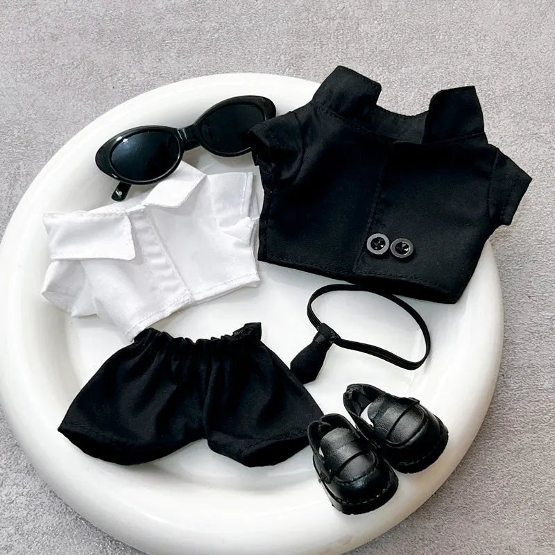 Black suit set for dolls with oval sunglasses and ankle boots, polyester material.
