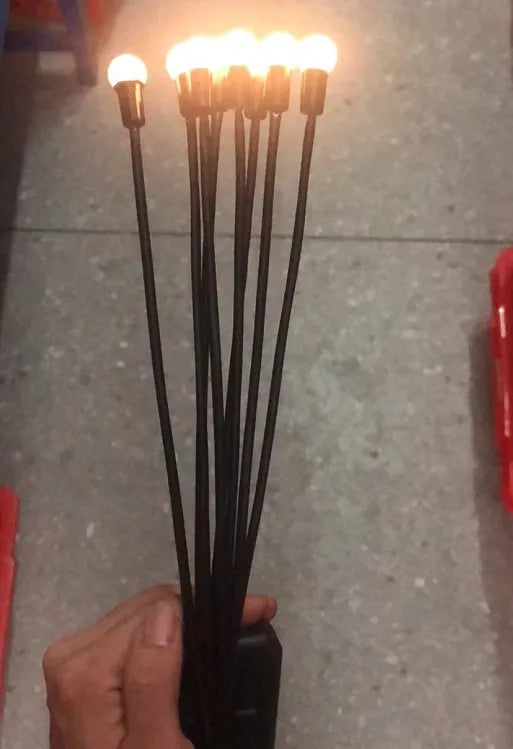 Solar-powered LED firefly ground lamp with multiple heads and ground spike for garden installation