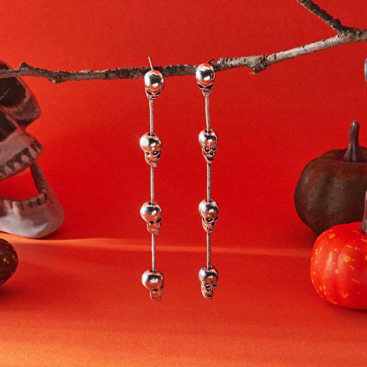Long skull fringe earrings in electroplated alloy with pumpkin skull charm, women's dangle style, one pair