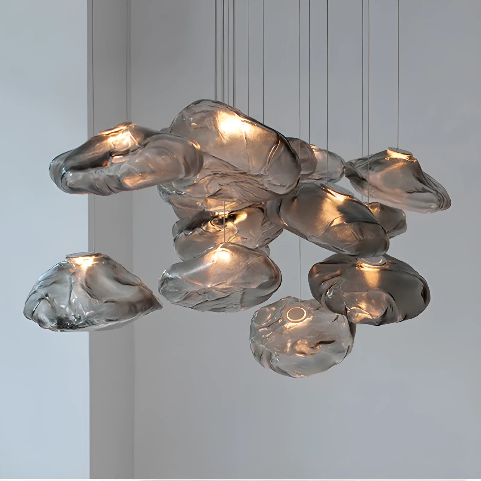 Modern fabric chandelier with glass shade in amber, clear, or smoke grey colour, shown in large and small size options.