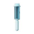 Blue reusable pet hair remover tool with a self-cleaning base on a fabric sofa.
