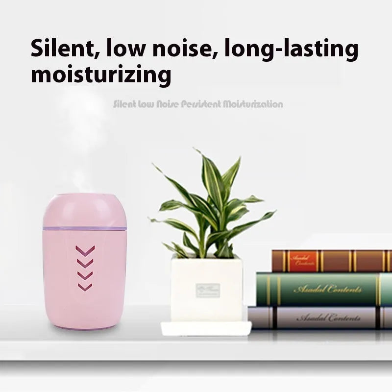 Round white portable USB air purifier for car and desktop use on a wooden surface.