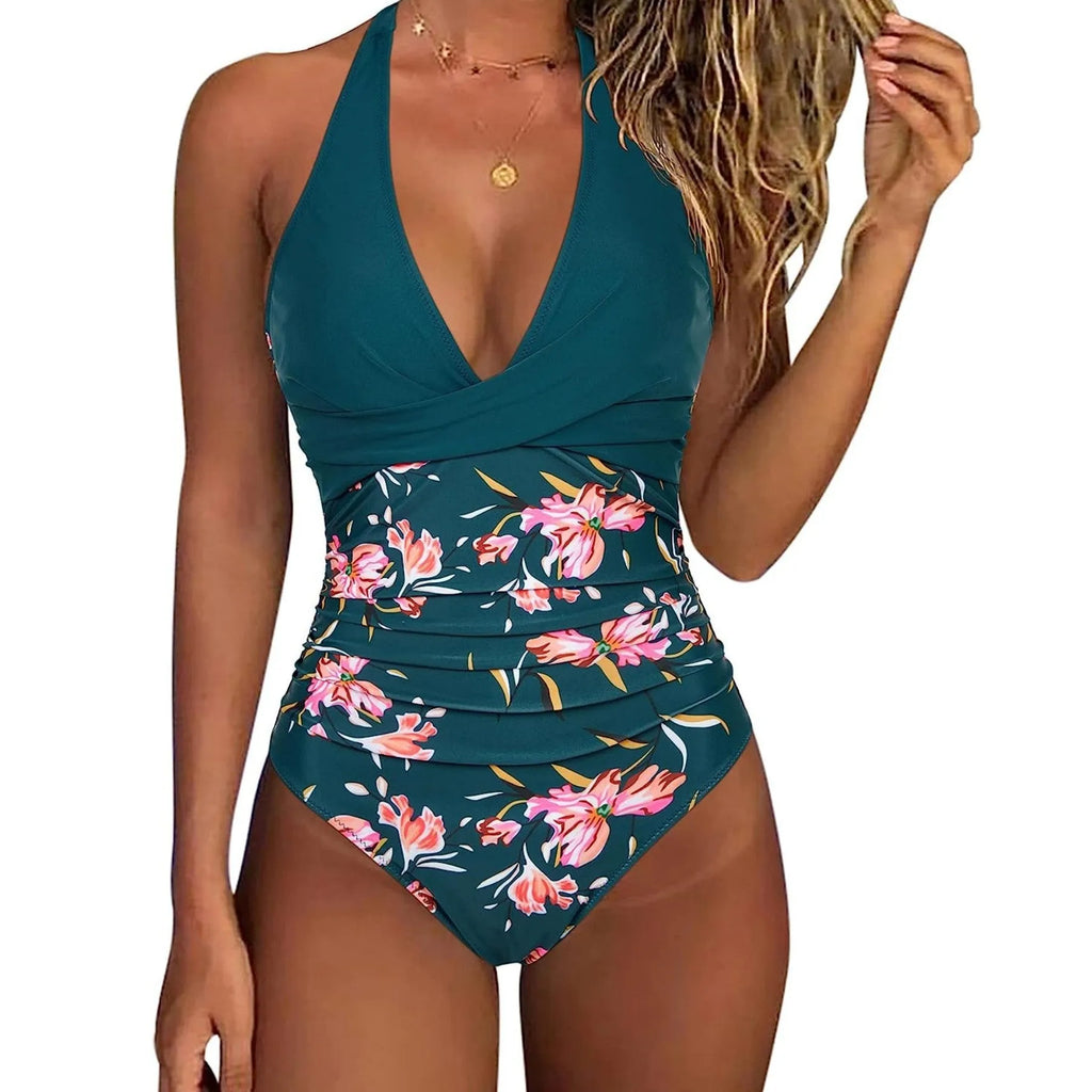 Women's printed one-piece swimsuit with lace-up front and backless gather detail.