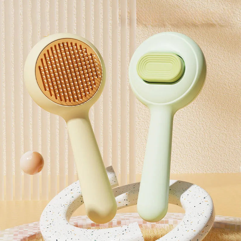 Pet grooming brush with stainless steel teeth and non-slip handle in green and yellow colours