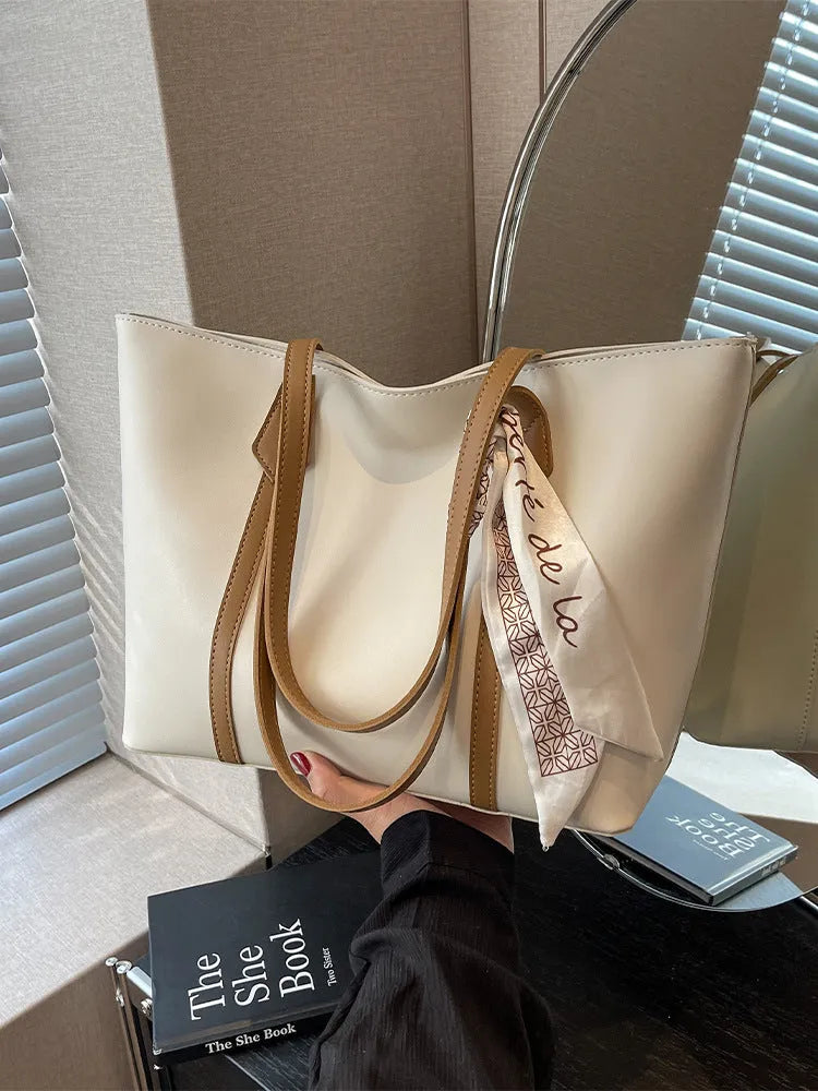 Large capacity bucket style tote bag with crossbody strap in multiple colour options