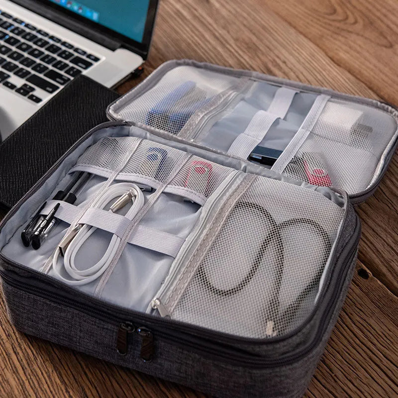 Grey waterproof double-layer travel cable organizer bag with portable handle and multiple pockets