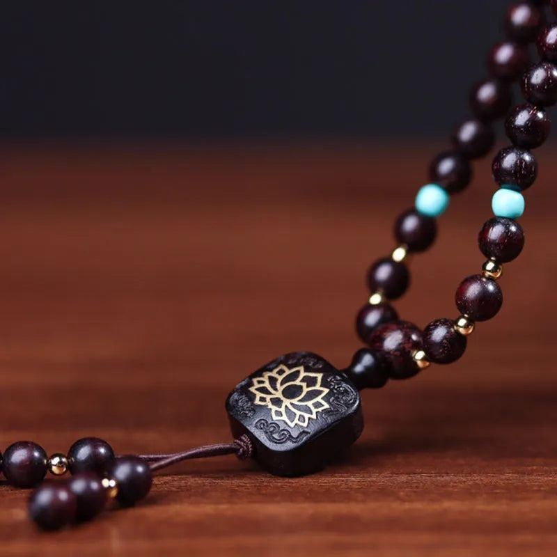 Zambia rosewood bead bracelet with 108 beads in flat lotus pendant design and grinding finish
