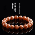 Natural old mine rhodochrosite round bead bracelet with ruyi detail, shown in 6mm and 8mm size options.