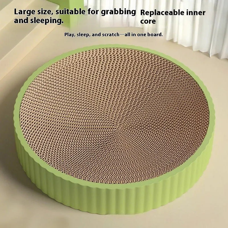 Green round cat scratching board with corrugated paper surface measuring 55cm diameter