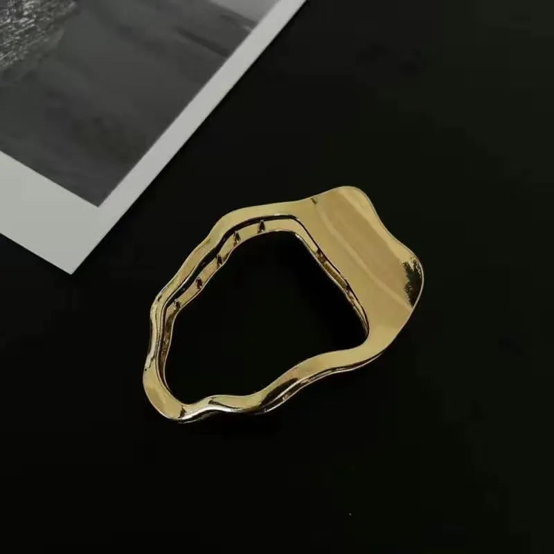 Women's zinc alloy hair barrette in gold or silver with geometric shape options