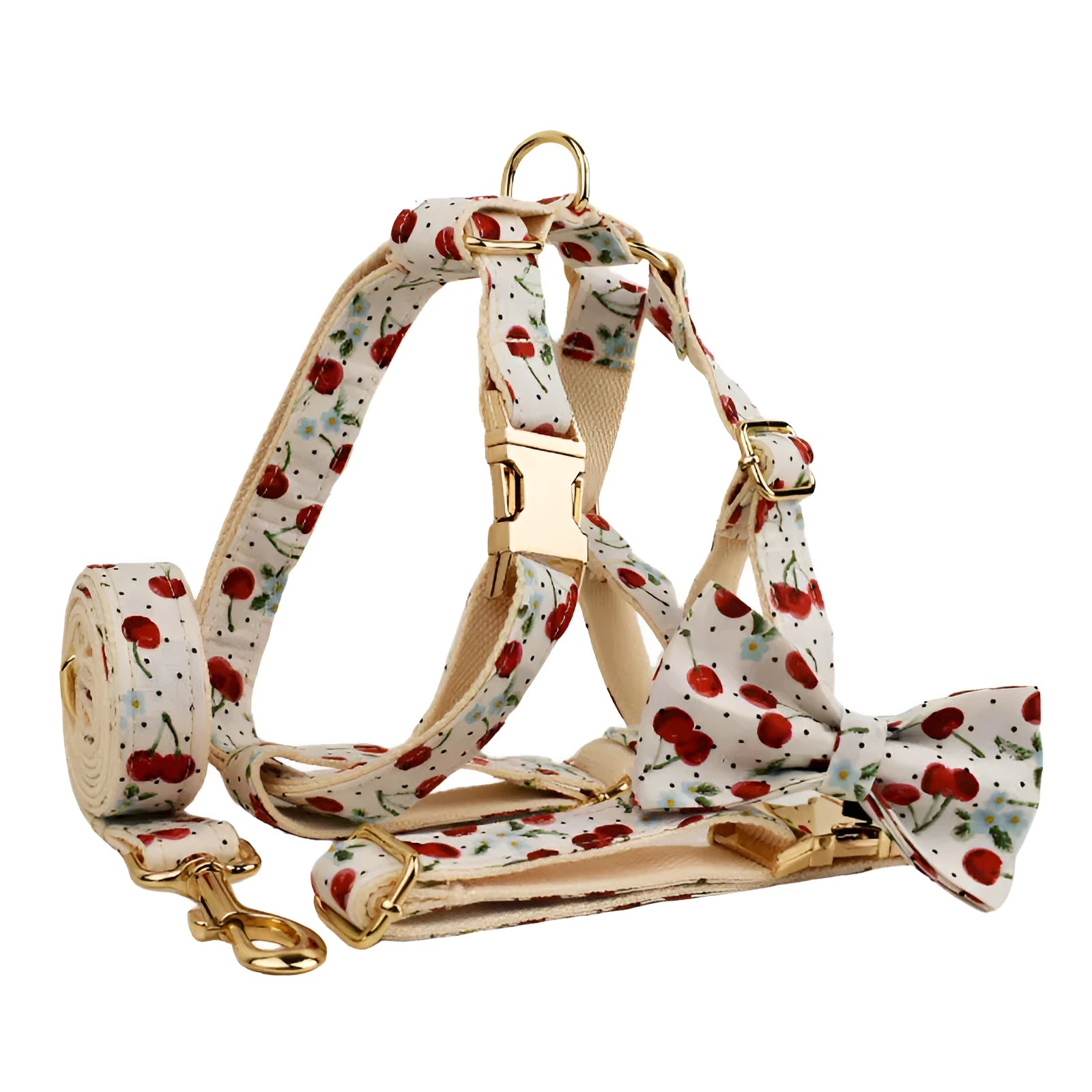 Red cherry printed cloth dog collar set with light gold buckle, matching leash, bow, vest, and bag.