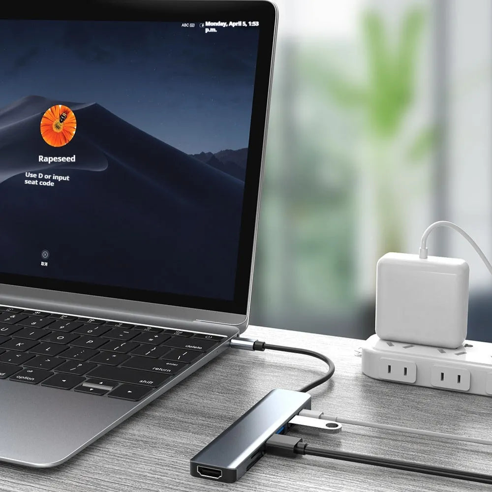 Seven-in-one Type-C USB expander hub with a short 0.145m cable on a white background.