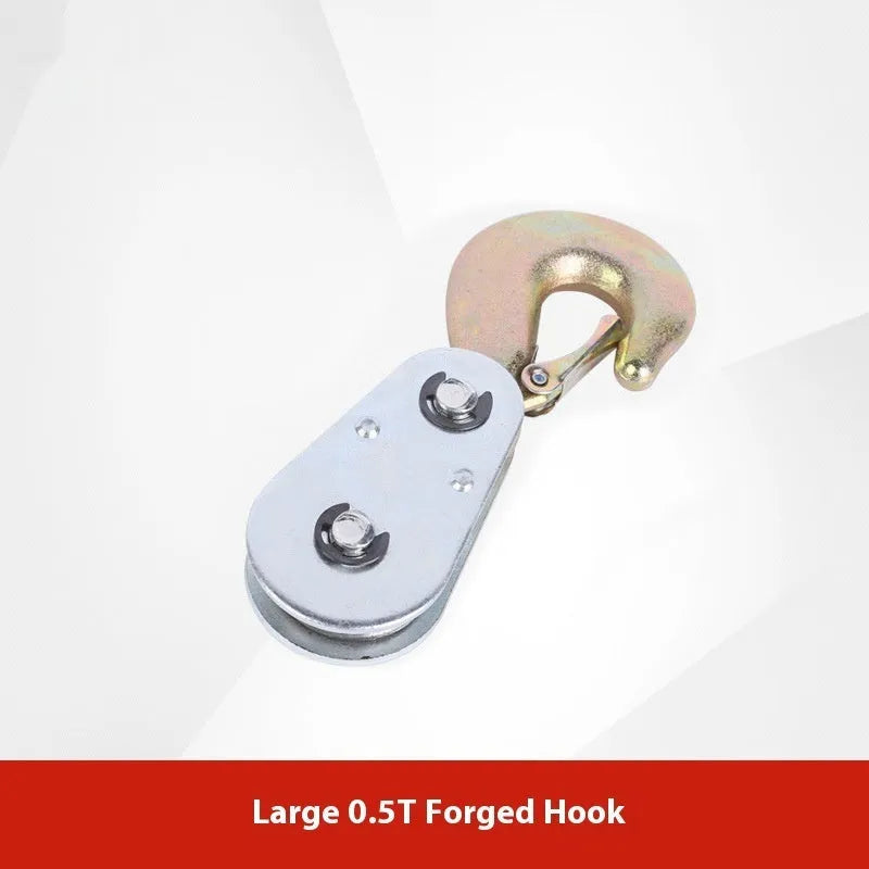 Small red industrial lifting pulley with a steel hook and safety latch for wire rope.