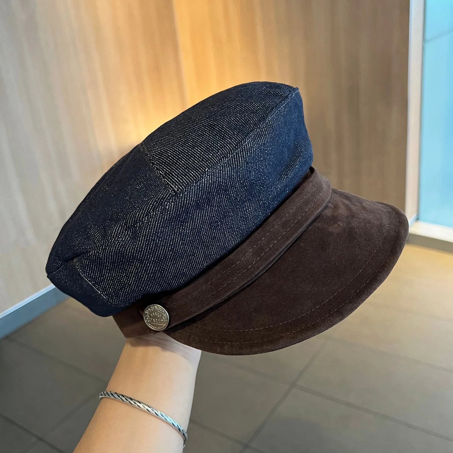 Dark blue denim octagonal newsboy hat with adjustable sizing for 54-58cm head circumference